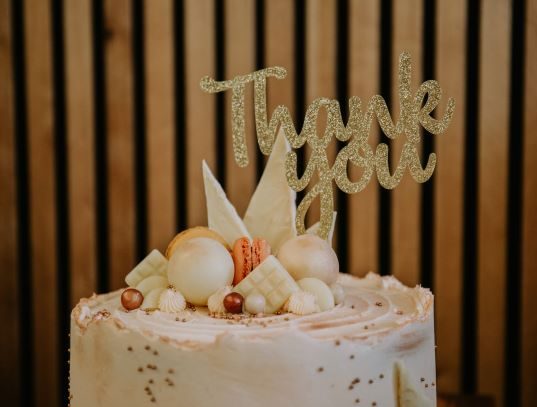 delicious cake with 'thank you' decoration