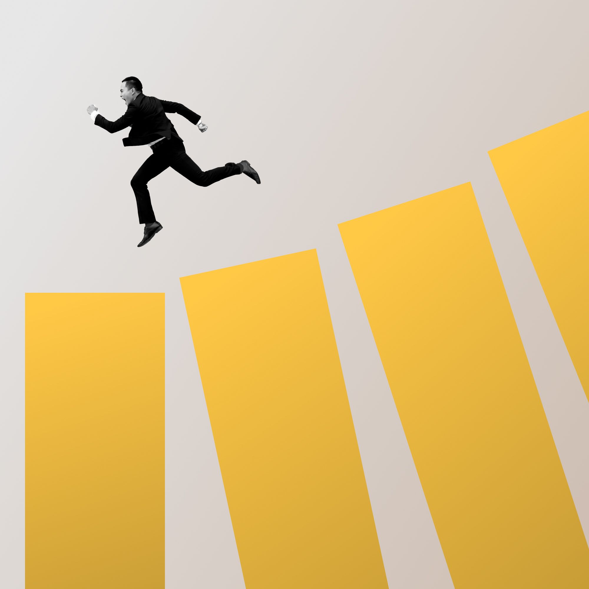 man jumping over yellow blocks